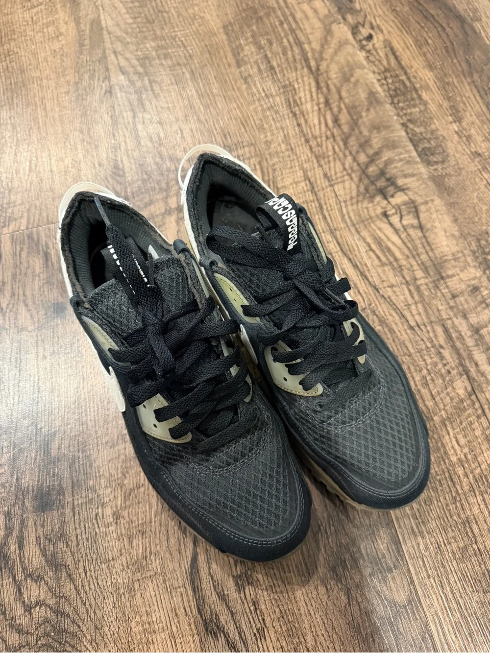Nike Black Sneaker with White Swoosh and Yellowed Midsole